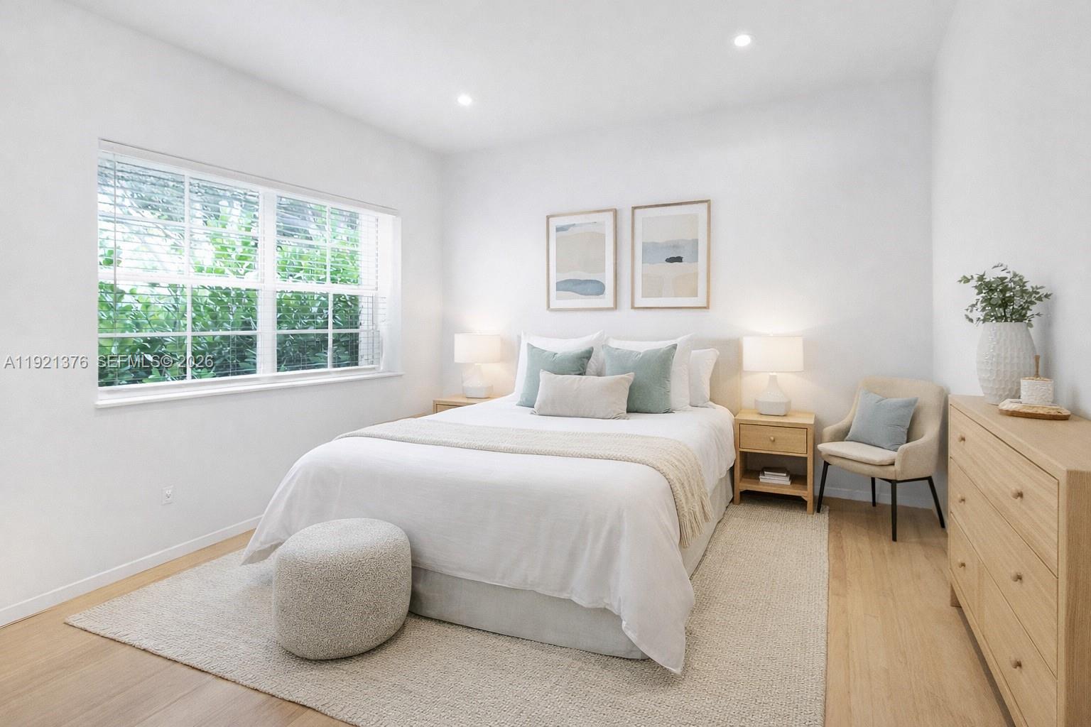 100 Southwest 30th Road Miami, FL 33129 - Photo 17 of 31 a bedroom with a bed and a window