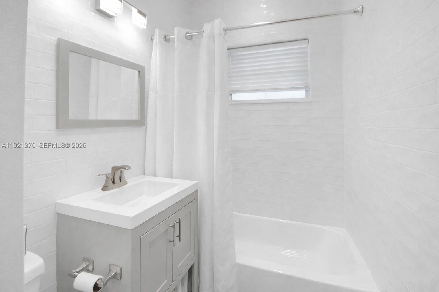 100 Southwest 30th Road Miami, FL 33129 - Photo 18 of 31 a bathroom with a sink a toilet and shower