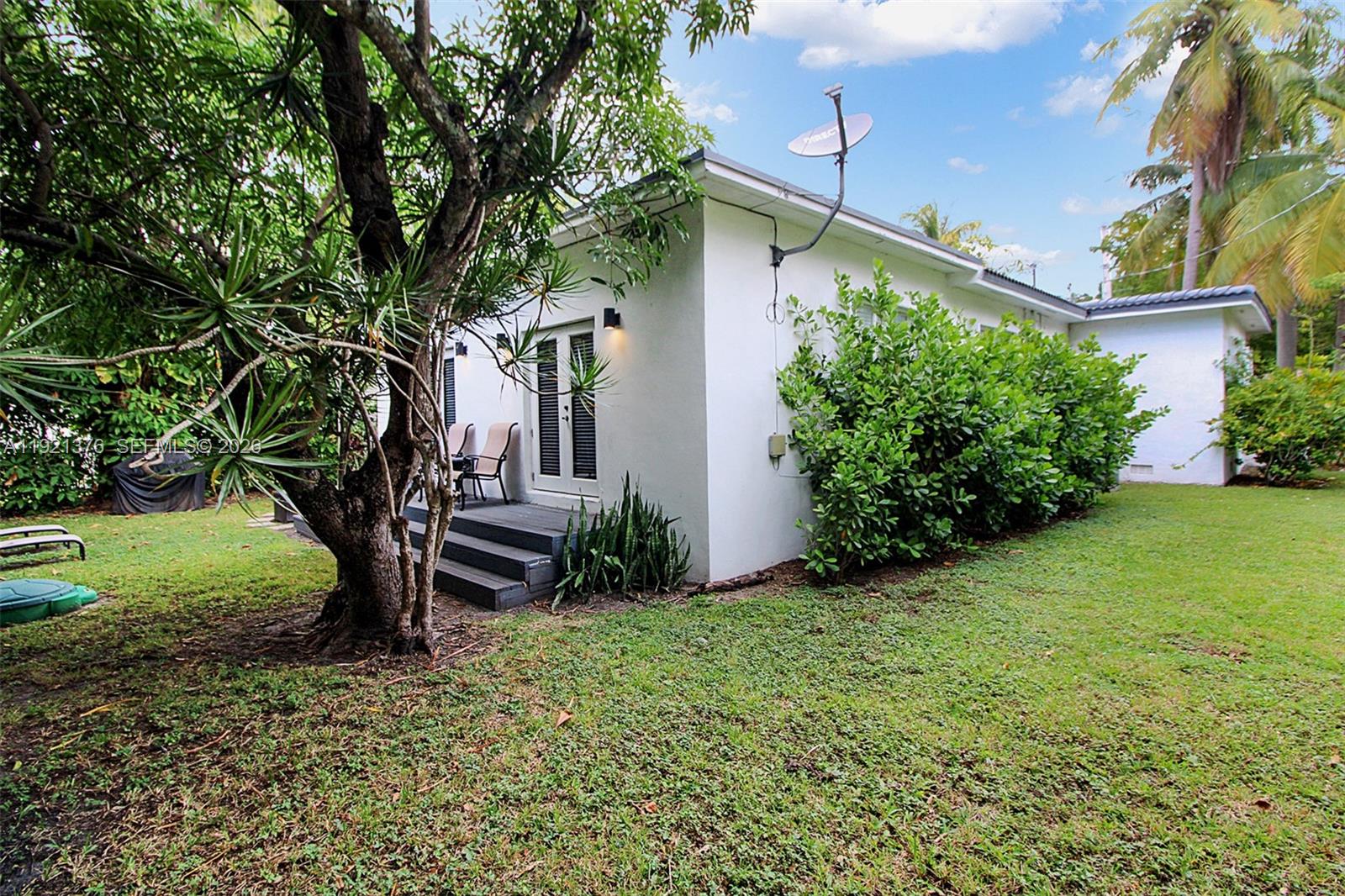 100 Southwest 30th Road Miami, FL 33129 - Photo 23 of 31 a view of a house with a backyard