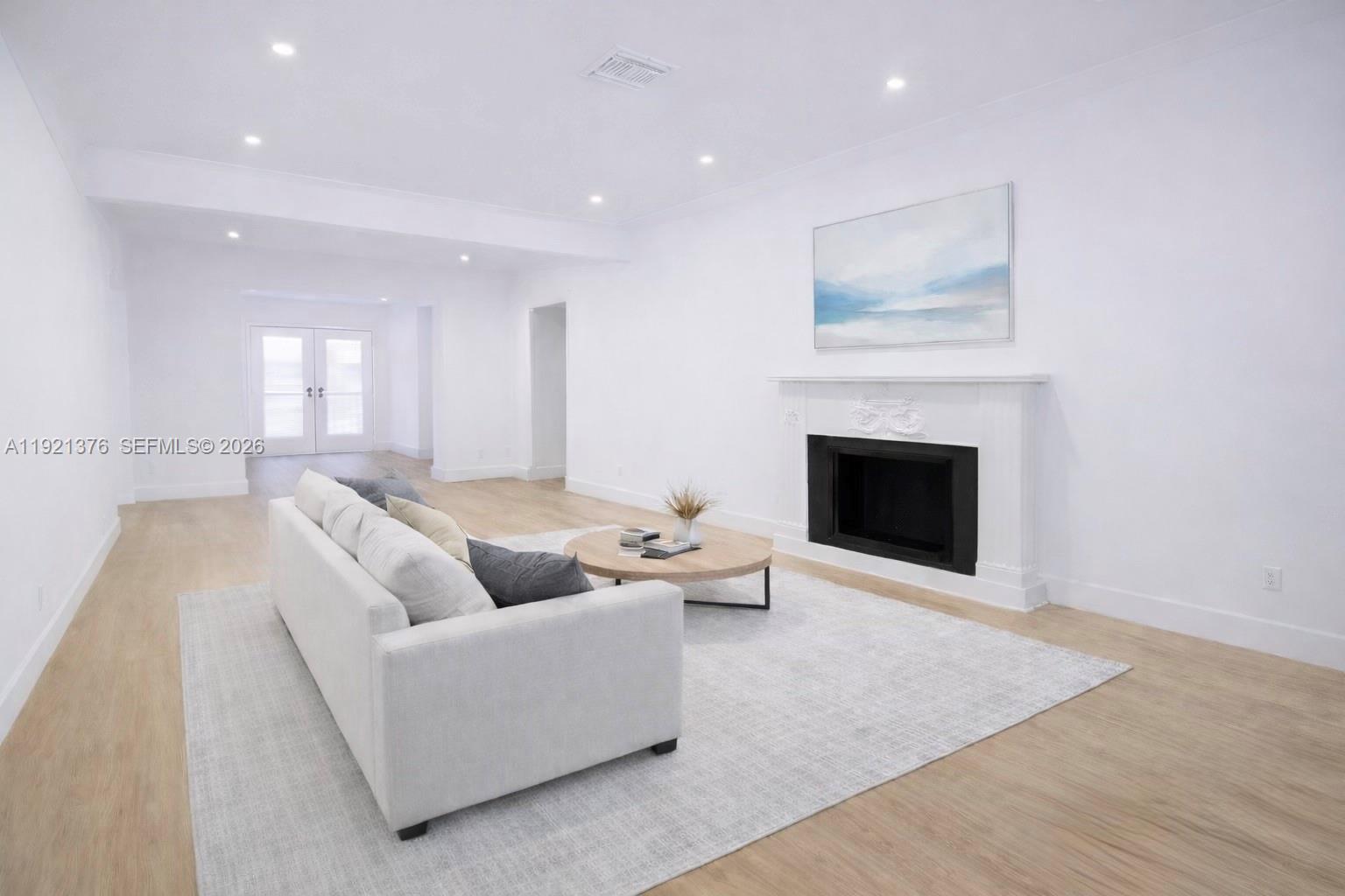 100 Southwest 30th Road Miami, FL 33129 - Photo 8 of 31 a living room with furniture and a fireplace