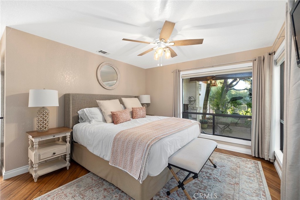 4613 Sleeping Indian Road Fallbrook, CA 92028 - Photo 25 of 75 a bedroom with a large bed and a window