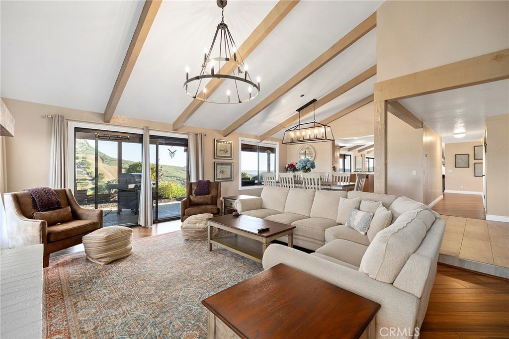 4613 Sleeping Indian Road Fallbrook, CA 92028 - Photo 27 of 75 a living room with furniture ceiling fan and a rug