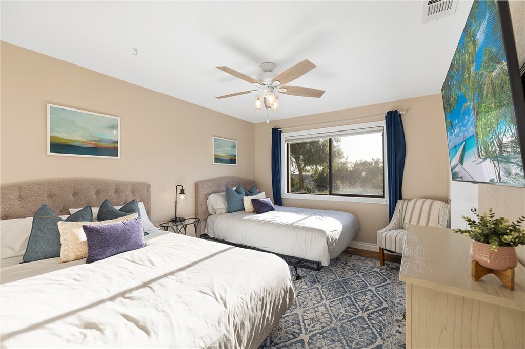 4613 Sleeping Indian Road Fallbrook, CA 92028 - Photo 32 of 75 a bedroom with two beds and a potted plant