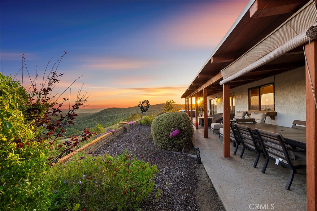 4613 Sleeping Indian Road Fallbrook, CA 92028 - Photo 35 of 75 a view of a patio with table and chairs and potted plants