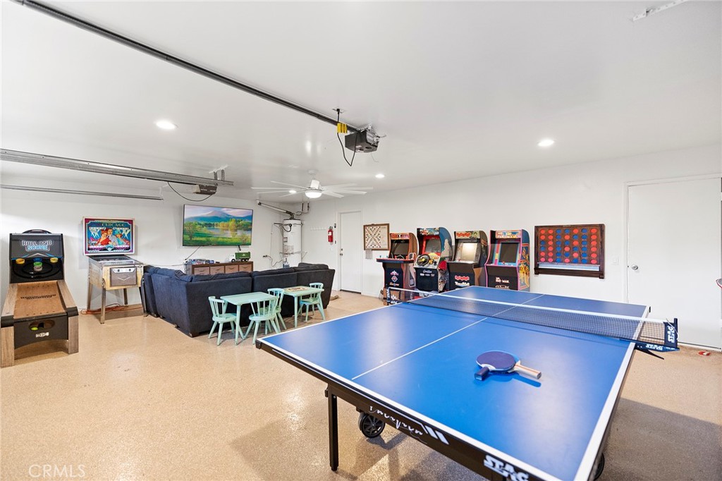 4613 Sleeping Indian Road Fallbrook, CA 92028 - Photo 39 of 75 a living room with furniture pool table and a flat screen tv
