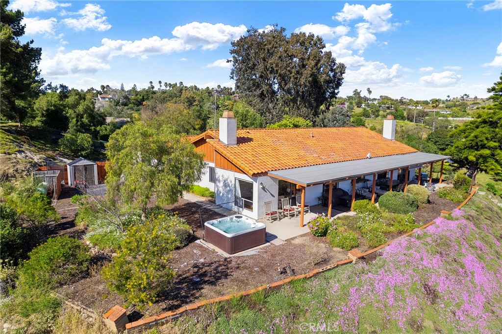 4613 Sleeping Indian Road Fallbrook, CA 92028 - Photo 66 of 75 an aerial view of a house with a big yard and large trees