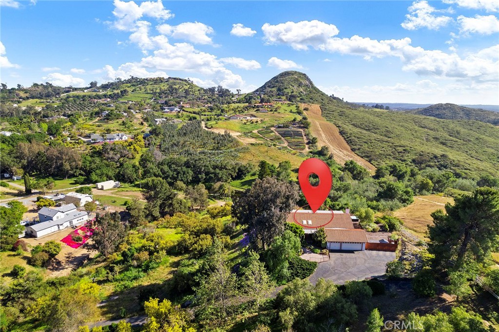 4613 Sleeping Indian Road Fallbrook, CA 92028 - Photo 70 of 75 a aerial view of a house with a yard and lake view