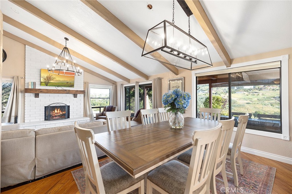 4613 Sleeping Indian Road Fallbrook, CA 92028 - Photo 8 of 75 a view of a dining room with furniture window and outside view