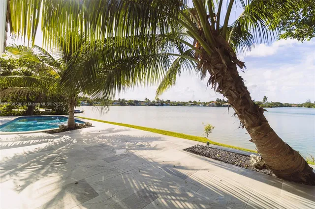 a view of swimming pool with a table and chairs