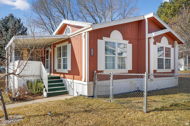 269 Mindella Way, Unit A Layton, UT 84041 - Photo 3 of 37 Manufactured / mobile home with a gate and a fenced front yard