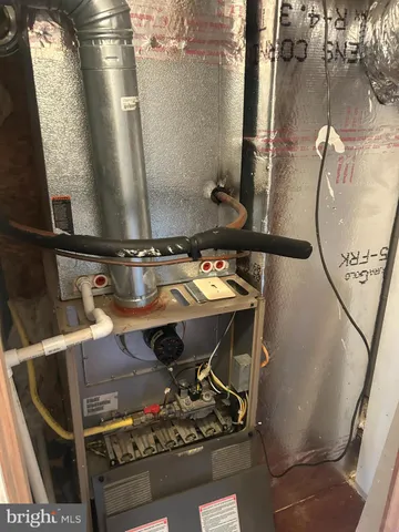 a view of a bedroom with wooden floor and windows