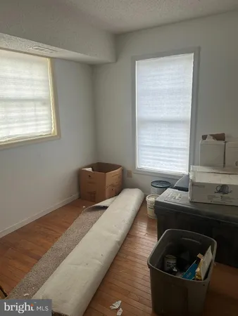 a view of a room that has a bed and a window
