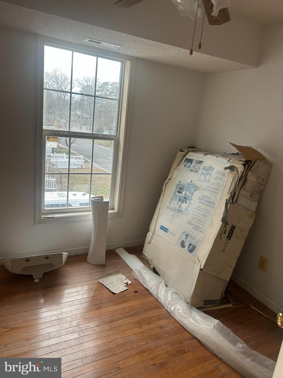313 Penn Street Salisbury, MD 21801 - Photo 16 of 40 a view of a bedroom with wooden floor and windows