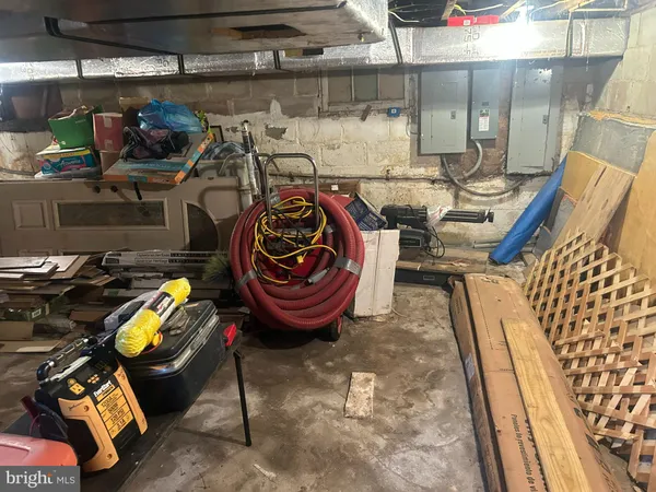 a view of a storage room with water heater and racks