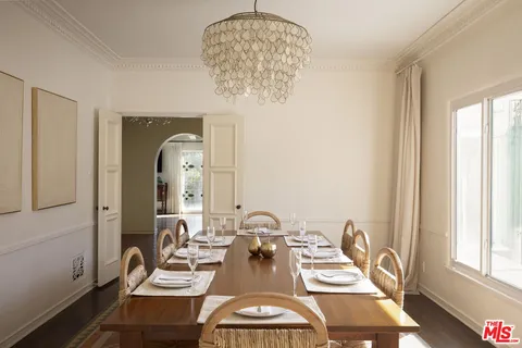 a view of a dining room with furniture and a window