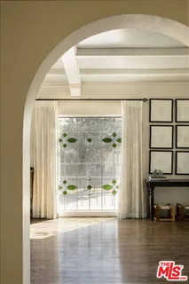a view of a living room and floor to ceiling window