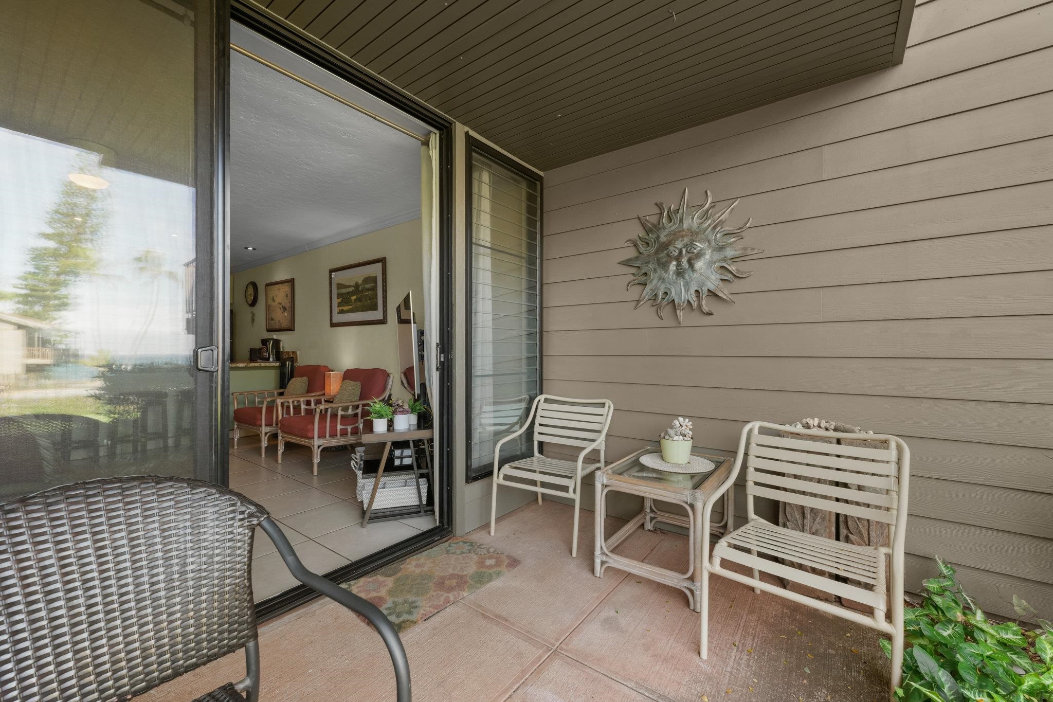 3975 Lower Honoapiilani Road, Unit 120 Lahaina, HI 96761 - Photo 8 of 22 a view of dining room and wooden table and chairs