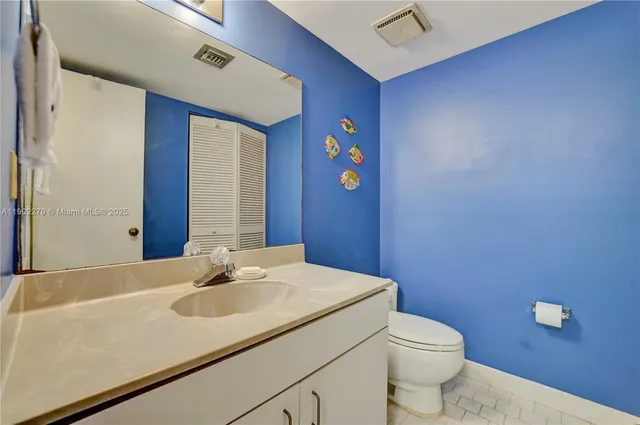 a view of a yard with plants and trees