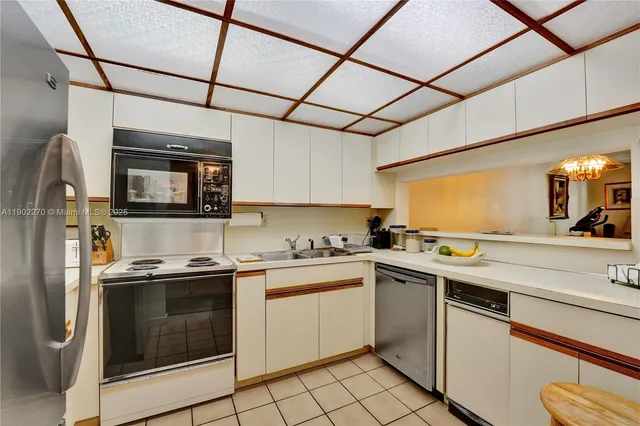 a bedroom with a bed furniture and book shelf