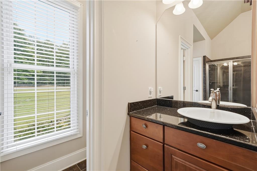97 Eagle Ridge Trail Cleveland, GA 30528 - Photo 37 of 58 a bathroom with a granite countertop sink and a window