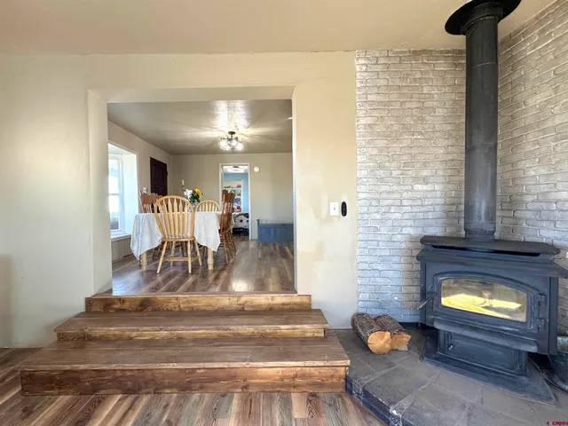a kitchen with kitchen island granite countertop a sink cabinets and stainless steel appliances