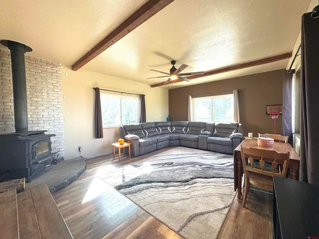 a kitchen with stainless steel appliances granite countertop a stove sink and cabinets