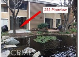 251 Pineview Irvine, CA 92620 - Photo 20 of 54 a front view of multi story residential apartment building with entryway