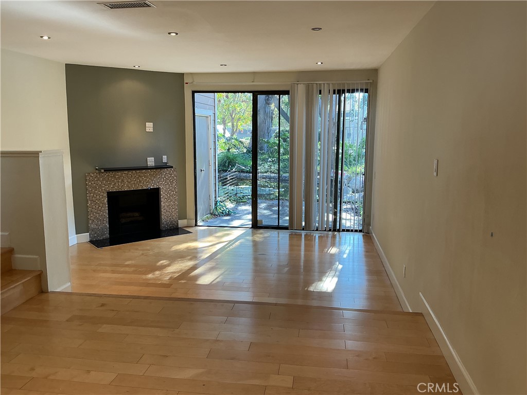 251 Pineview Irvine, CA 92620 - Photo 3 of 54 a view of an empty room with wooden floor and a window