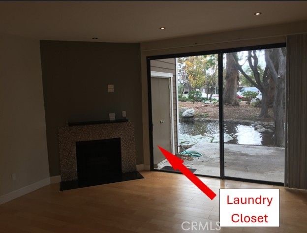 251 Pineview Irvine, CA 92620 - Photo 32 of 54 a living room with a fireplace and a floor to ceiling window