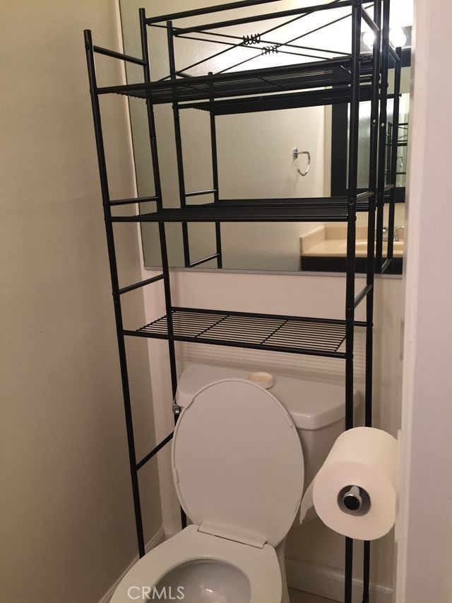 251 Pineview Irvine, CA 92620 - Photo 36 of 54 a bathroom with a toilet and a mirror