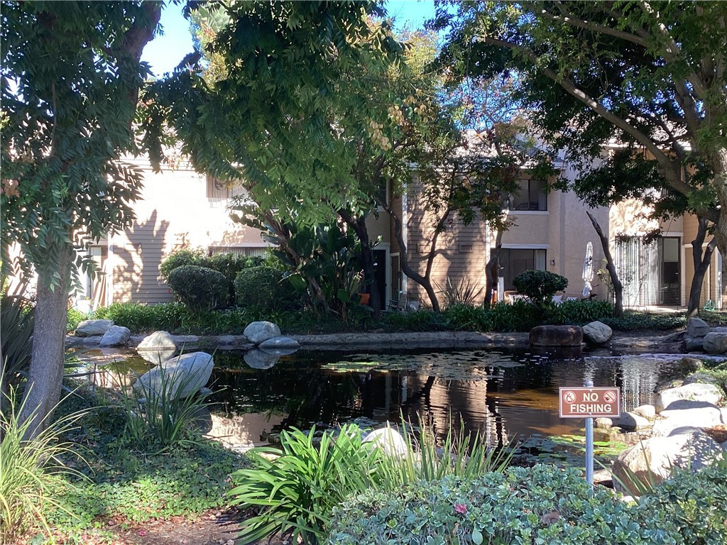 251 Pineview Irvine, CA 92620 - Photo 50 of 54 a backyard of a house with barbeque oven and outdoor seating