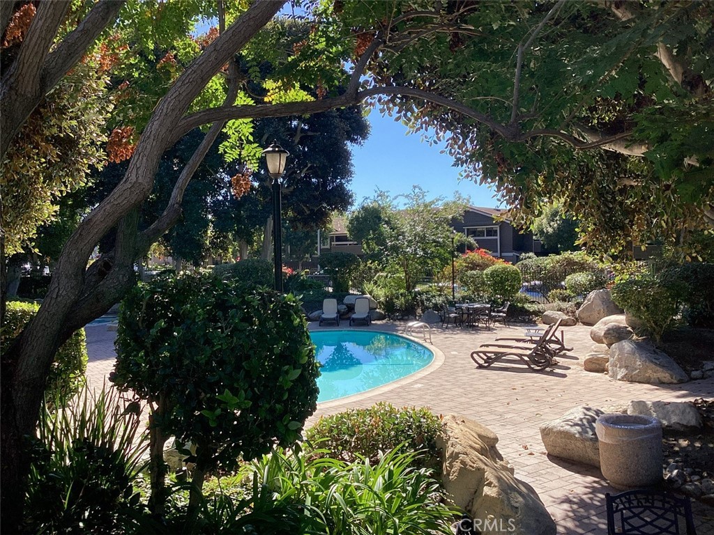 251 Pineview Irvine, CA 92620 - Photo 51 of 54 a view of a patio with table and chairs and a large tree