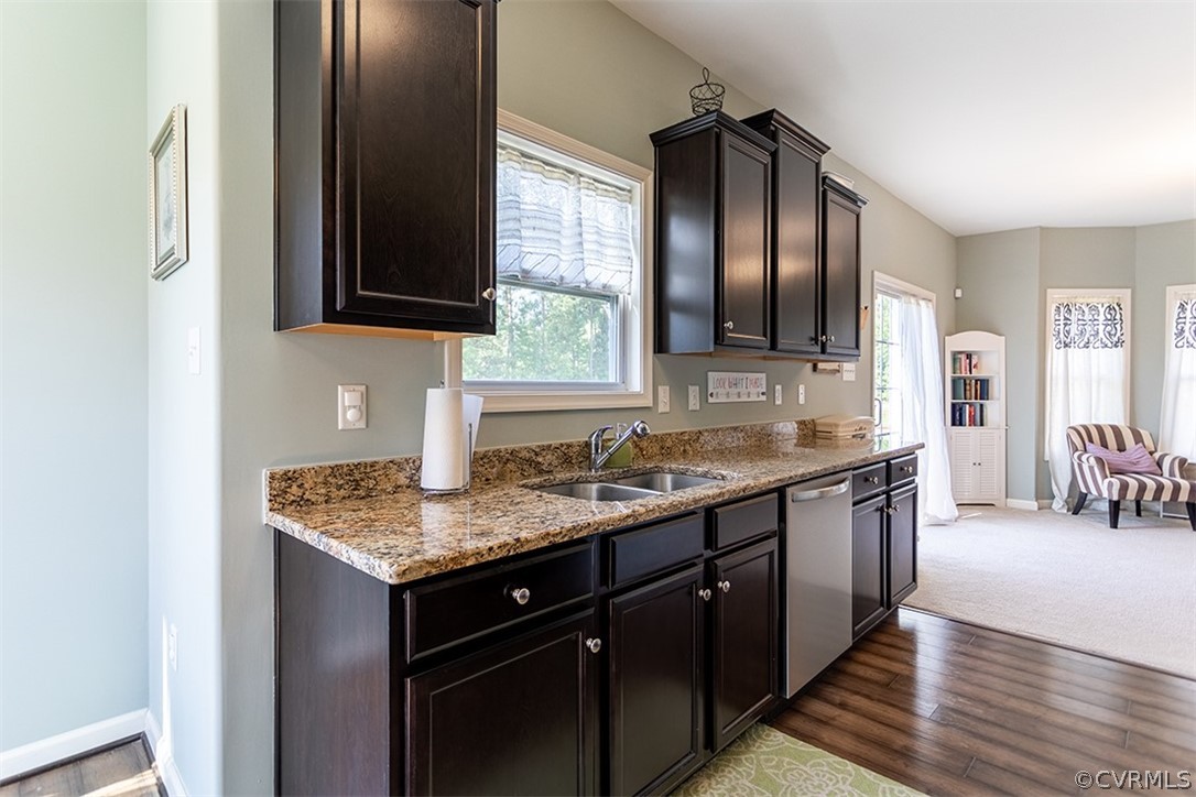 5531 Garden Grove Road Chesterfield, VA 23832 - Photo 11 of 32 a kitchen with a granite countertop counter space a sink and cabinets