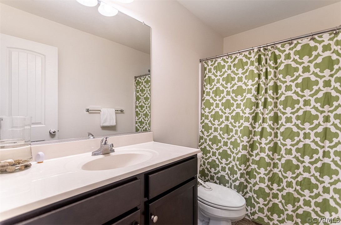 5531 Garden Grove Road Chesterfield, VA 23832 - Photo 18 of 32 a bathroom with a sink toilet and shower