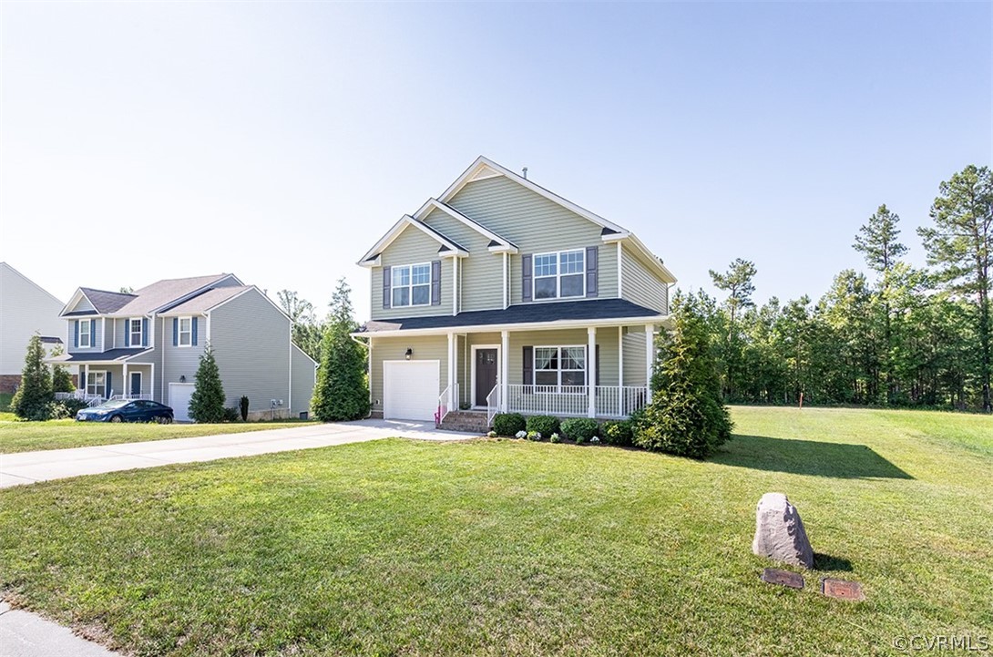 5531 Garden Grove Road Chesterfield, VA 23832 - Photo 3 of 32 a front view of a house with a yard and trees