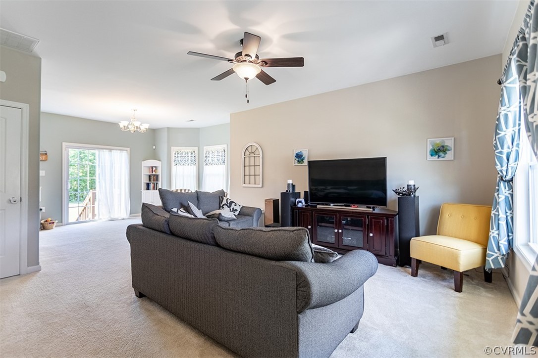 5531 Garden Grove Road Chesterfield, VA 23832 - Photo 8 of 32 a living room with furniture and a flat screen tv