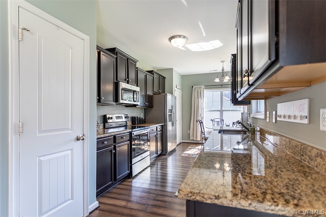 5531 Garden Grove Road Chesterfield, VA 23832 - Photo 10 of 32 a kitchen with stainless steel appliances granite countertop a refrigerator a stove top oven a sink and dishwasher
