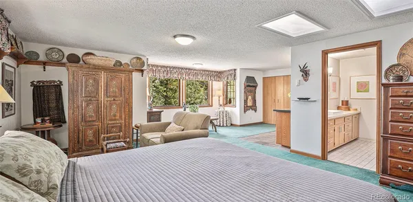a bed room with a bed and a large window