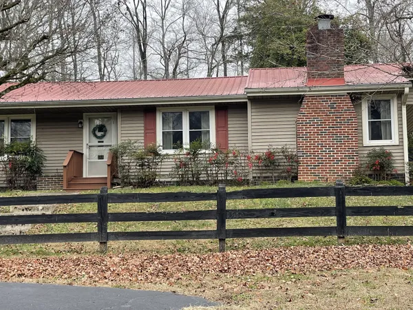 a view of a house with a fence