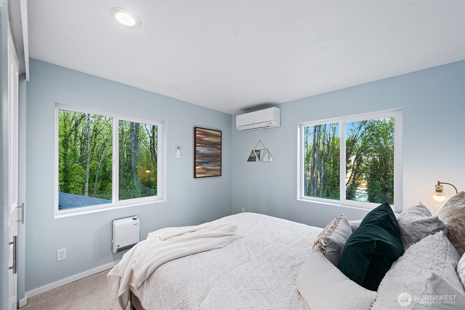 3265 31st Avenue Southwest Seattle, WA 98126 - Photo 11 of 18 a bedroom with a bed and a window