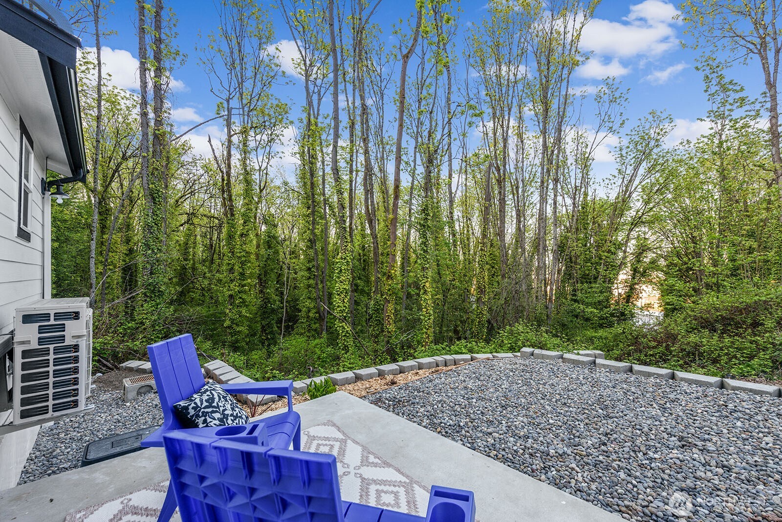3265 31st Avenue Southwest Seattle, WA 98126 - Photo 17 of 18 a backyard of a house with outdoor seating