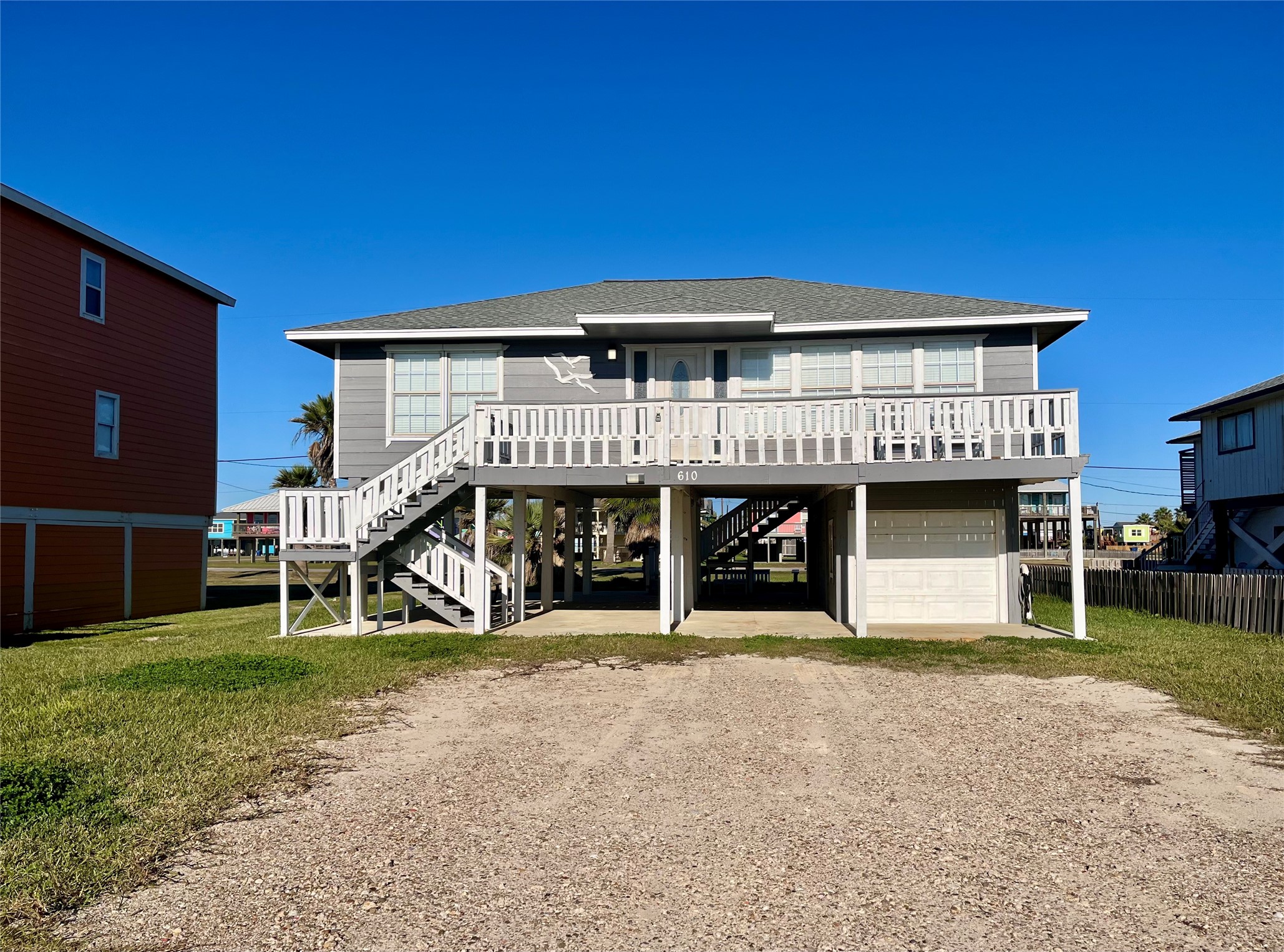 610 Seashell Drive Surfside Beach, TX 77541 - Photo 1 of 42 a view of a house with a yard and sitting area