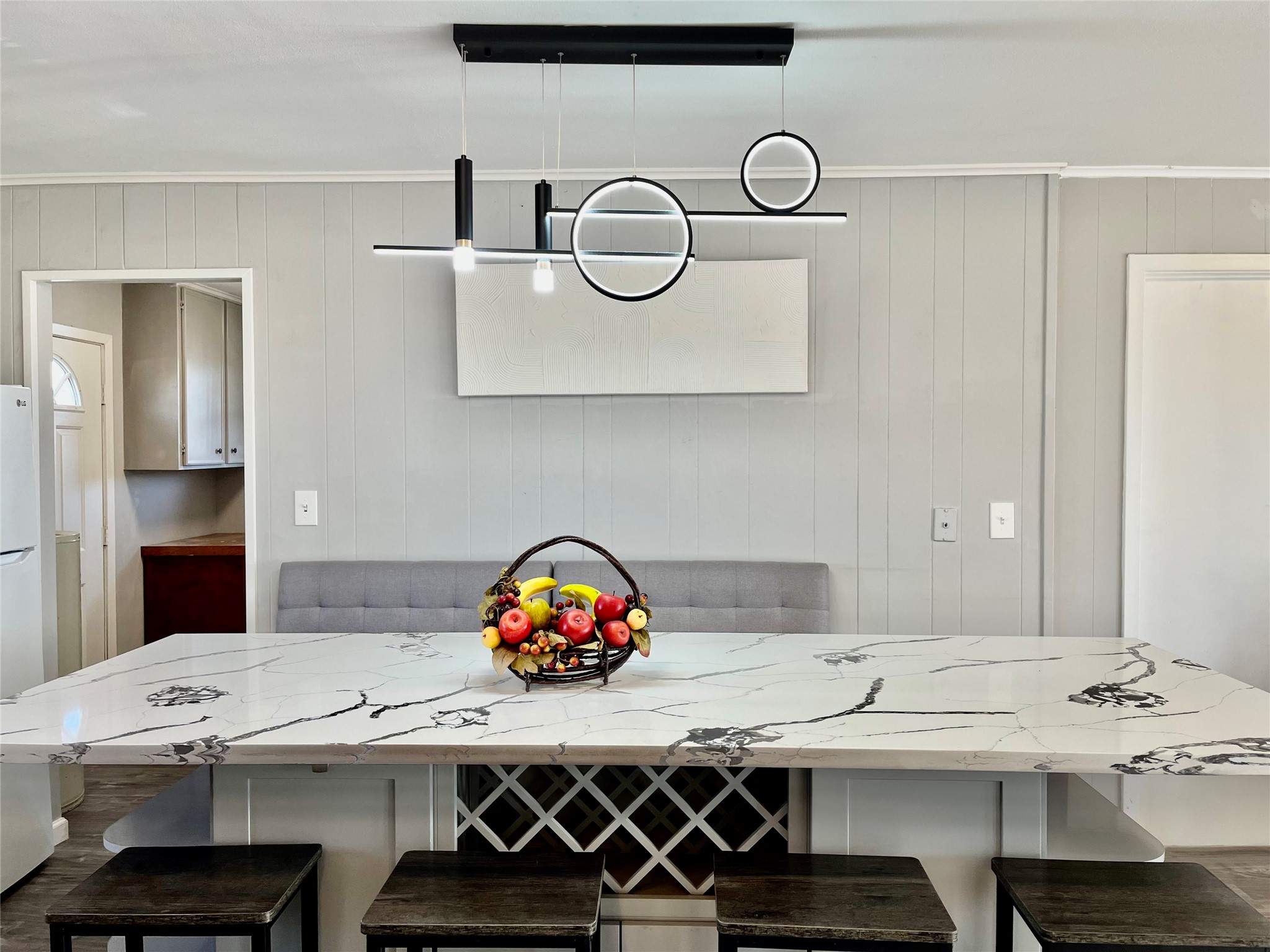 610 Seashell Drive Surfside Beach, TX 77541 - Photo 14 of 42 a kitchen with a table a stove and white cabinets
