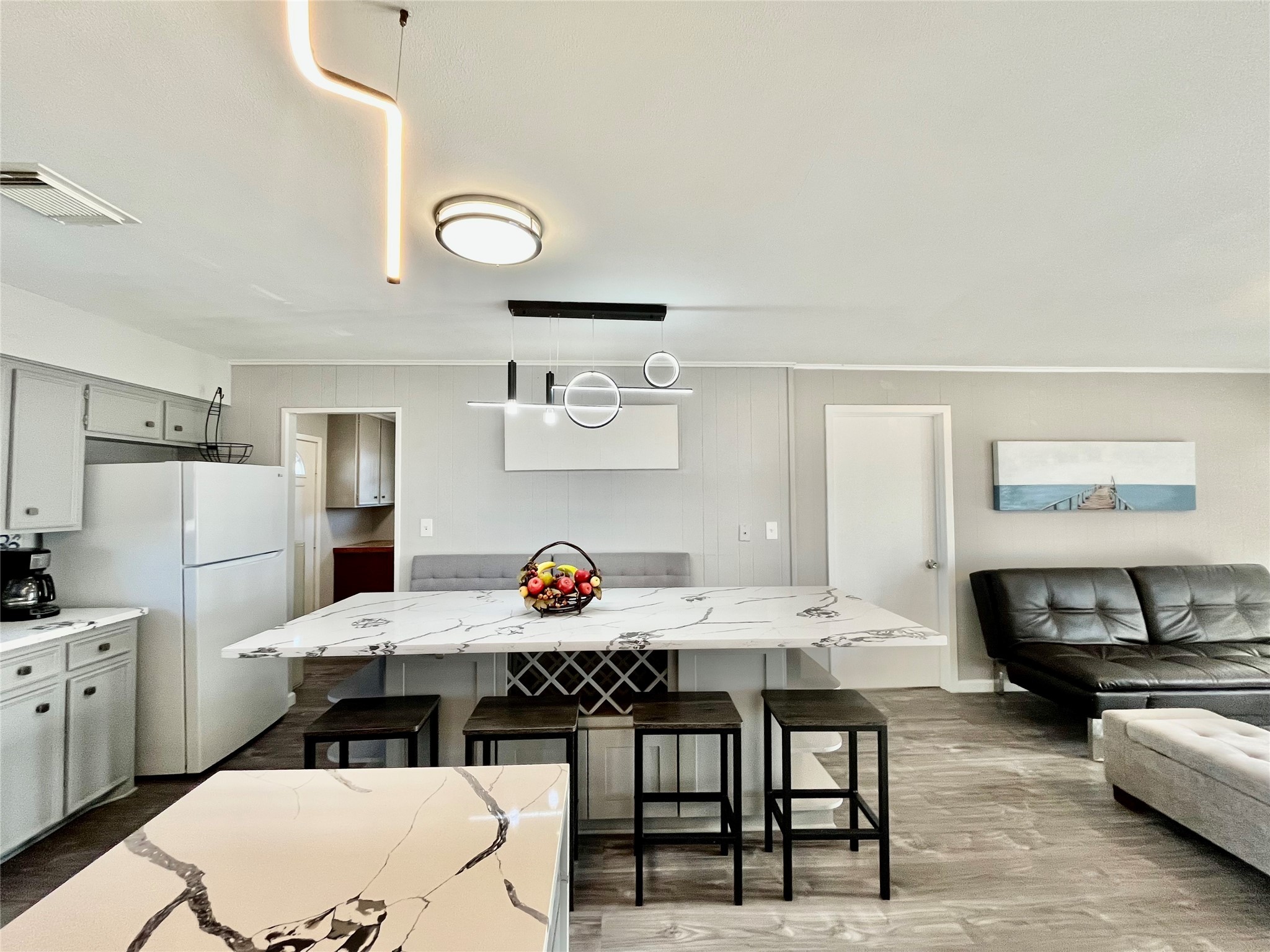 610 Seashell Drive Surfside Beach, TX 77541 - Photo 20 of 42 a view of a dining room with furniture and wooden floor