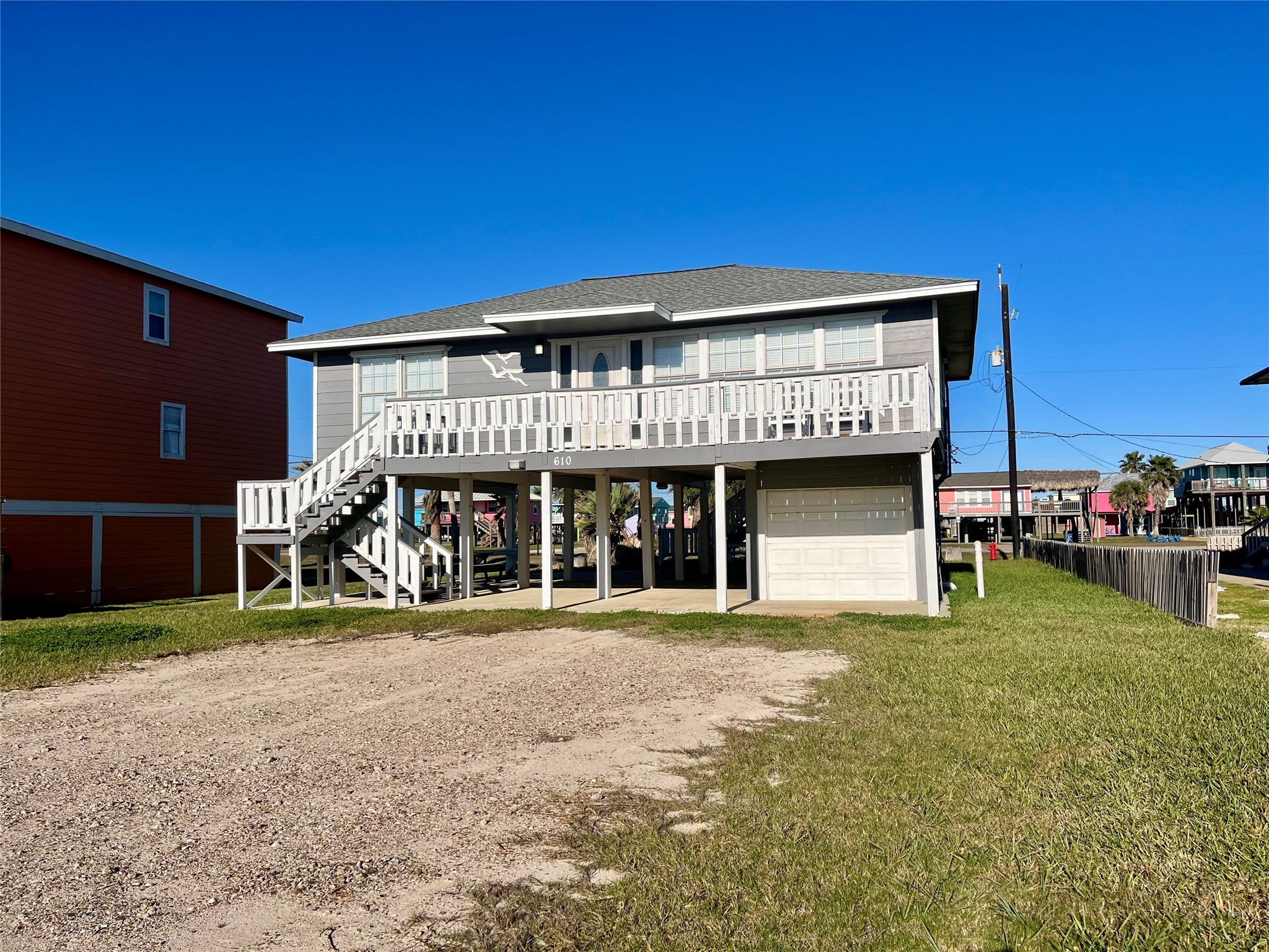 610 Seashell Drive Surfside Beach, TX 77541 - Photo 2 of 42 a view of a chairs and table in front of house