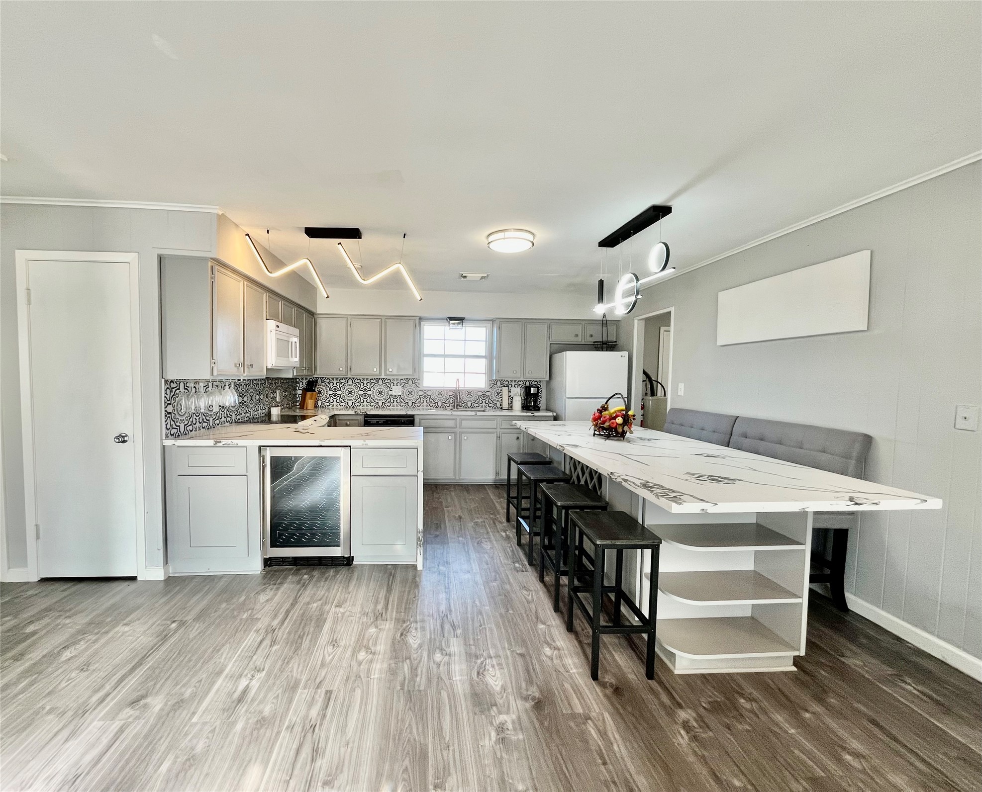610 Seashell Drive Surfside Beach, TX 77541 - Photo 22 of 42 a kitchen with stainless steel appliances granite countertop a lot of counter space and wooden floor