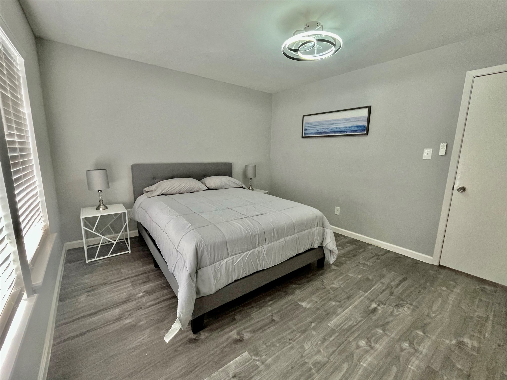 610 Seashell Drive Surfside Beach, TX 77541 - Photo 26 of 42 a bedroom with a bed and a window