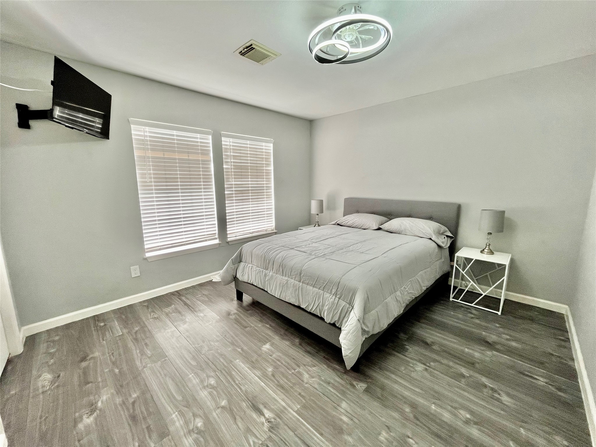 610 Seashell Drive Surfside Beach, TX 77541 - Photo 27 of 42 a bedroom with a bed and a flat screen tv