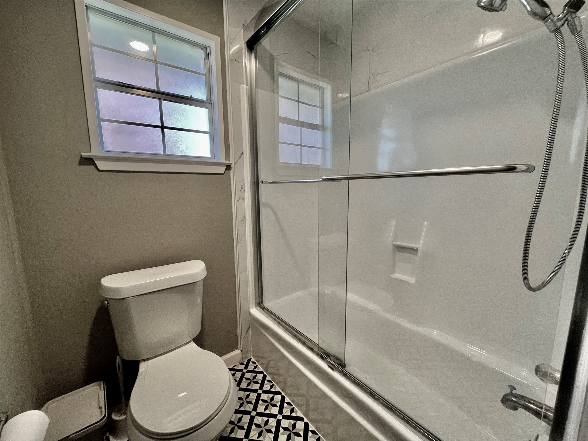 610 Seashell Drive Surfside Beach, TX 77541 - Photo 28 of 42 a white toilet sitting next to a bath tub and shower