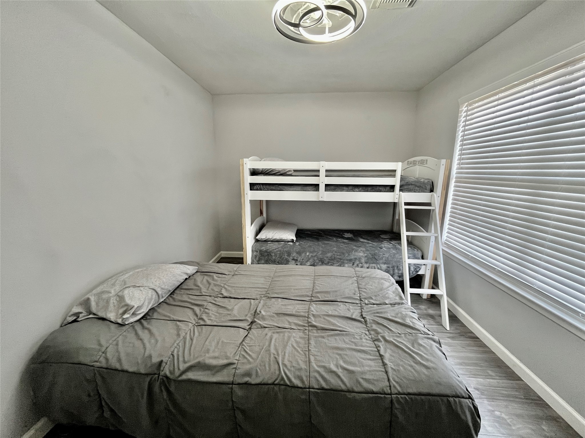 610 Seashell Drive Surfside Beach, TX 77541 - Photo 30 of 42 a bedroom with a bed and a window